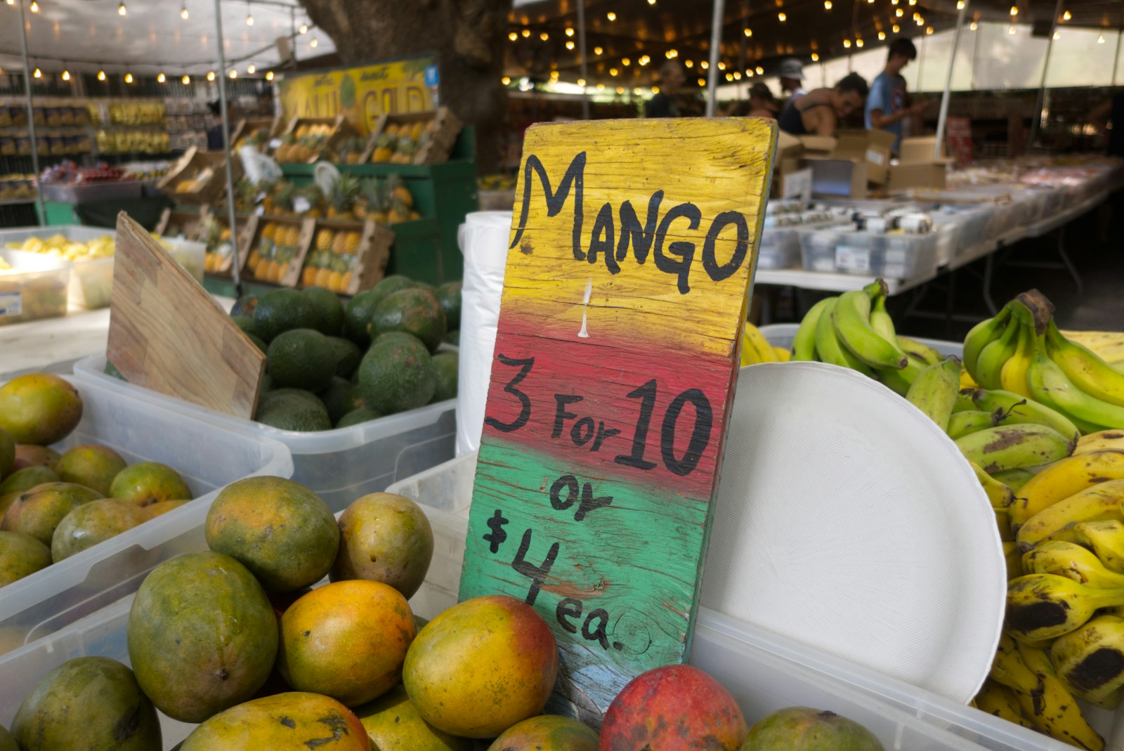 Fresh tropical fruit and produce at a Maui farmers market stall