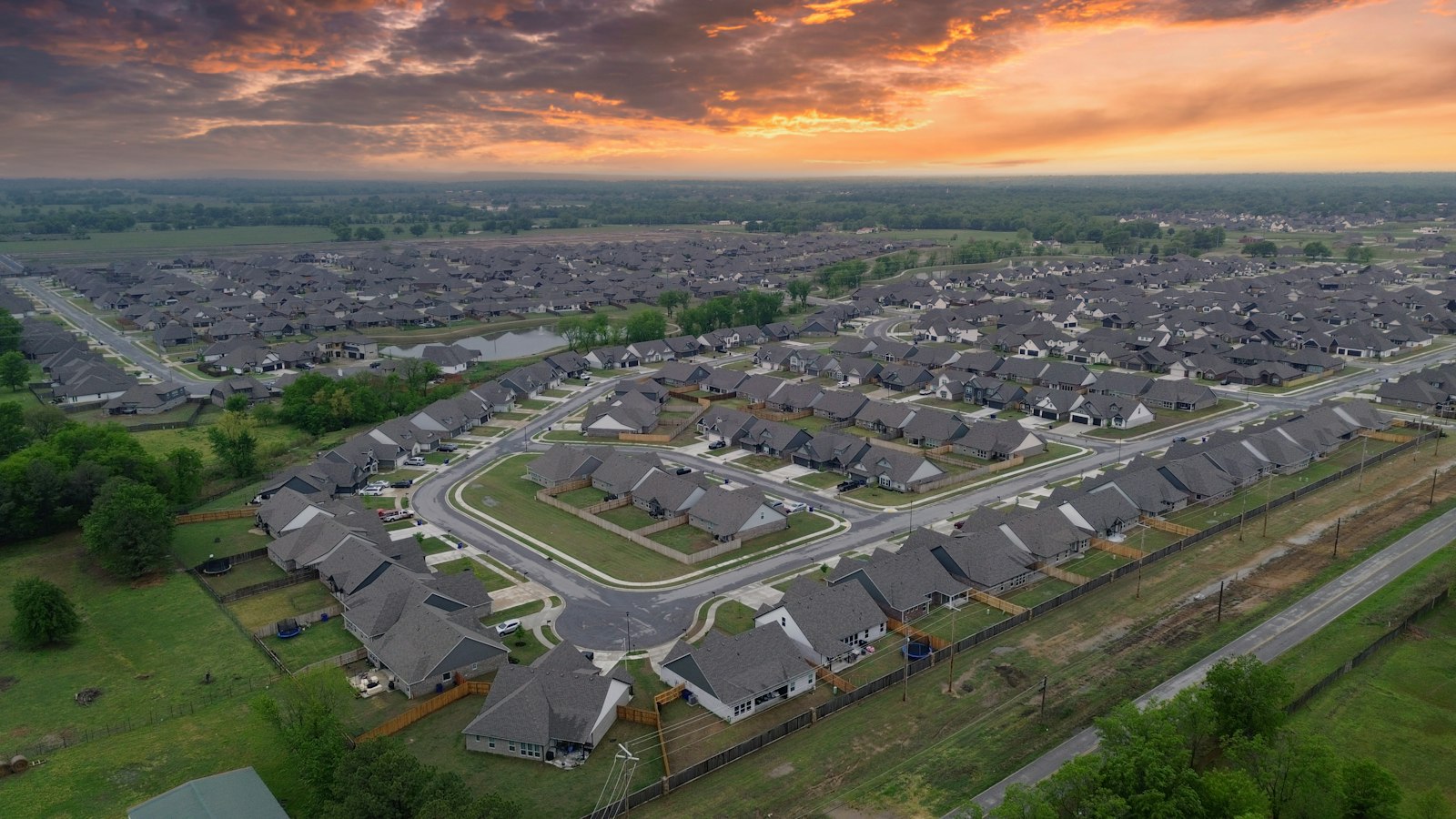 An aerial view of a new subdivision at sunset
