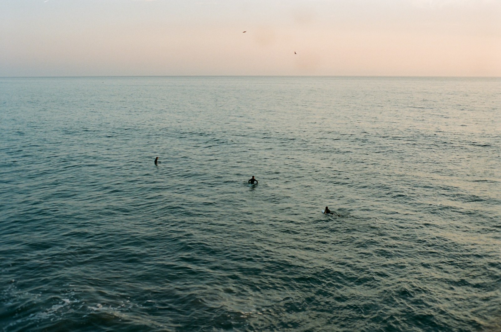 Paddlers out on flat water in early light