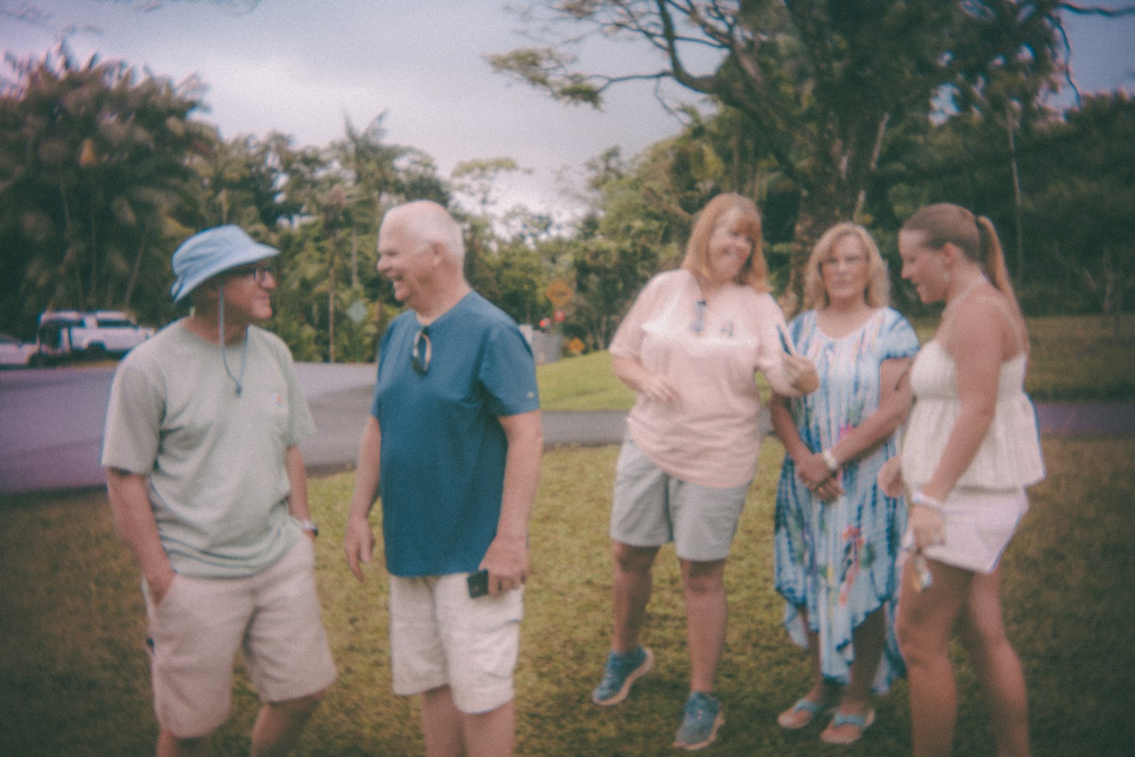 Older adults standing outdoors talking together