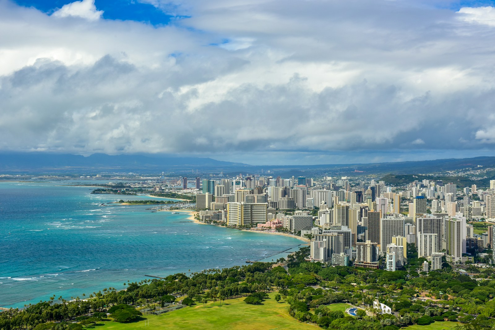 Aerial view of Honolulu, Waikiki and Ala Moana Beach Park on a sunny day, the backdrop for things to do in Honolulu this weekend.